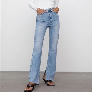 SLIM FLARED SLITTED HIGH RISE JEANS
